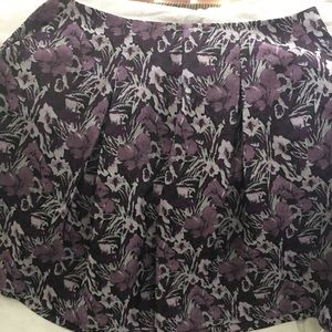 Purple, pocketed, pleated skirt.